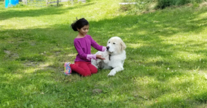 Dorina Mousavi playing with a dog