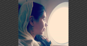 Ghanimat Azhdari sitting in a plane
