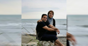 Sara Hamzeei and her husband, Amir Hossein Ovaysi - by the sea