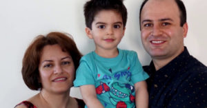 Jiwan Rahimi with his parents, Farideh Gholami and Razgar Rahimi